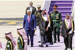 A person in a suit walking with a group of men in military uniforms
AI-generated content may be incorrect.