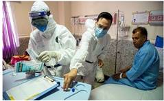 A group of people in protective suits
AI-generated content may be incorrect.