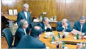 A group of men in suits sitting around a table

AI-generated content may be incorrect.