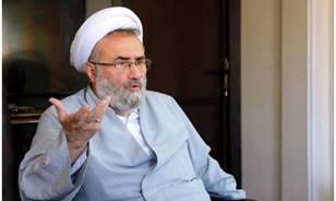 A person in a white turban and a gray robe

AI-generated content may be incorrect.