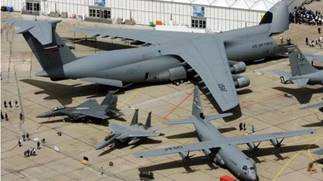 A group of airplanes in a hangar

AI-generated content may be incorrect.